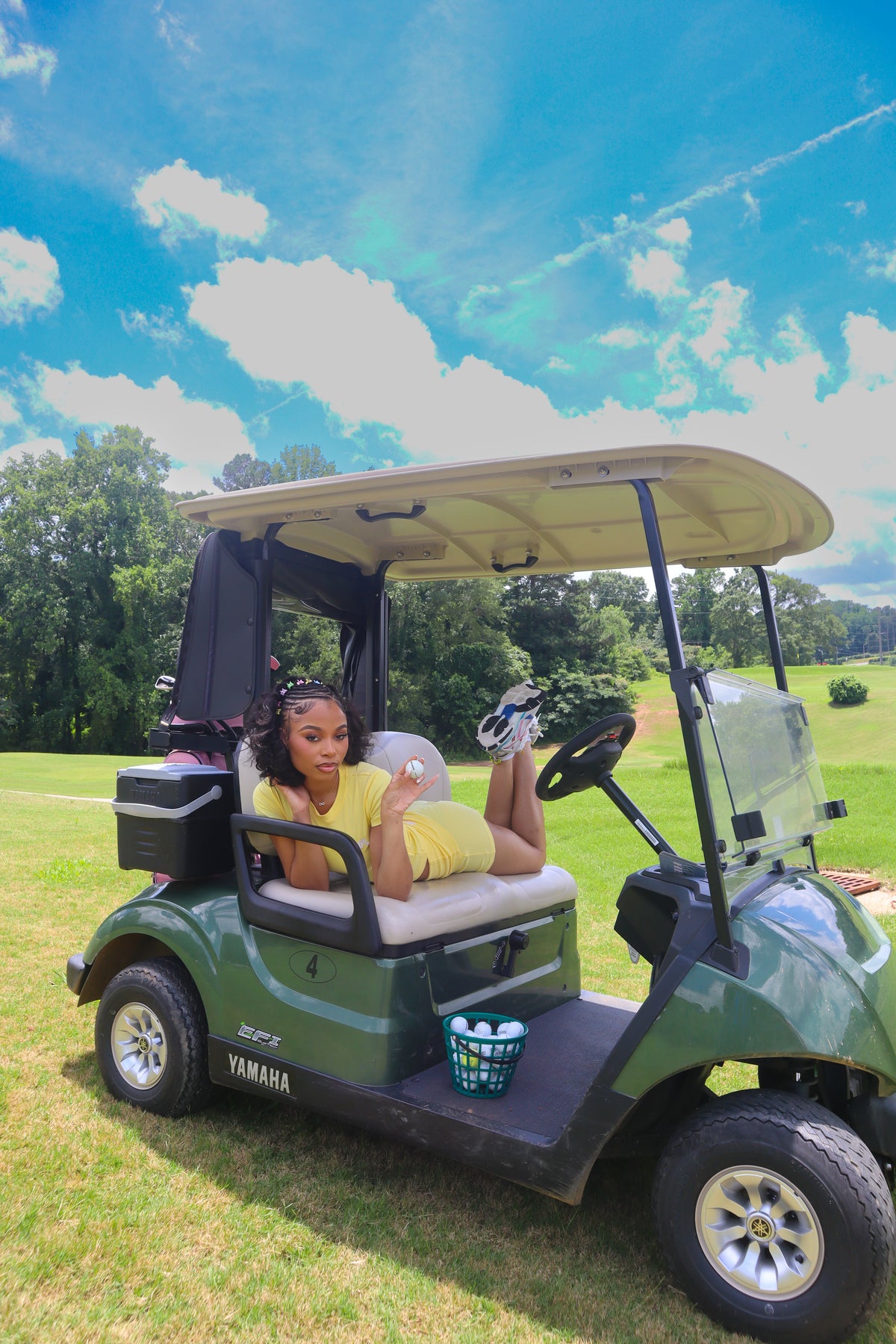 SAR girl in the Lemon Drop set on a golf cart